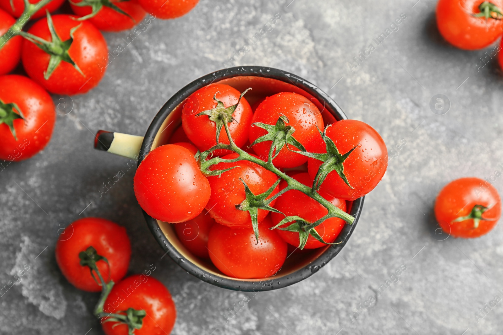 Photo of Flat lay composition with ripe tomatoes on grey background