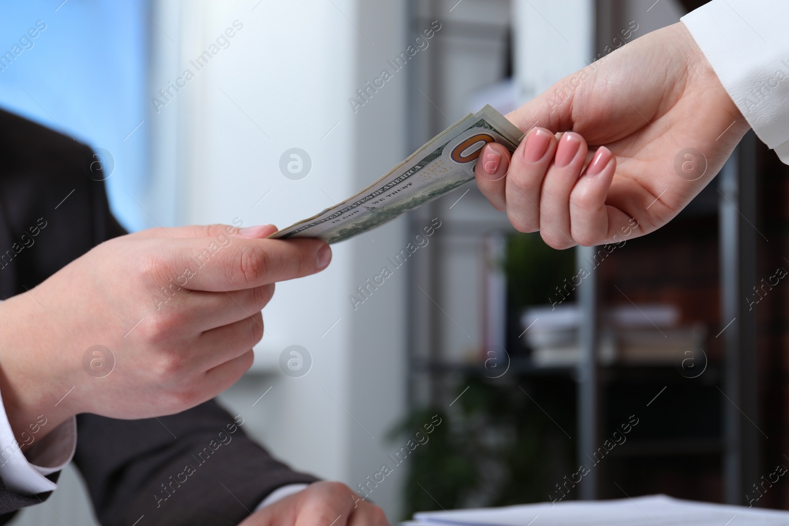 Photo of Man giving money to woman indoors, closeup. Currency exchange