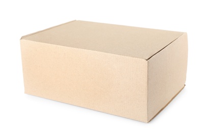 Photo of Closed cardboard box on white background. Mockup for design