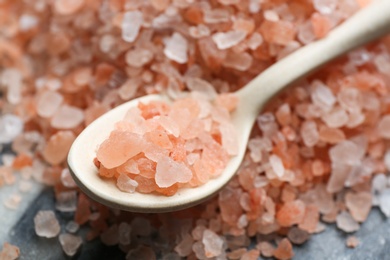 Photo of Spoon with pink himalayan salt, closeup view