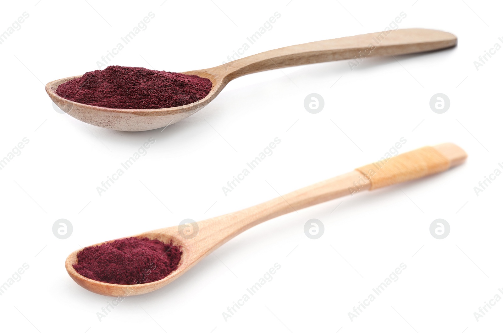 Image of Wooden spoons with acai powder on white background