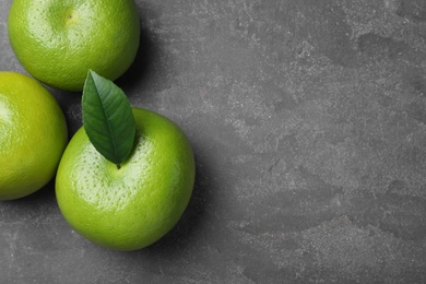 Fresh ripe sweeties on grey table, flat lay. Space for text