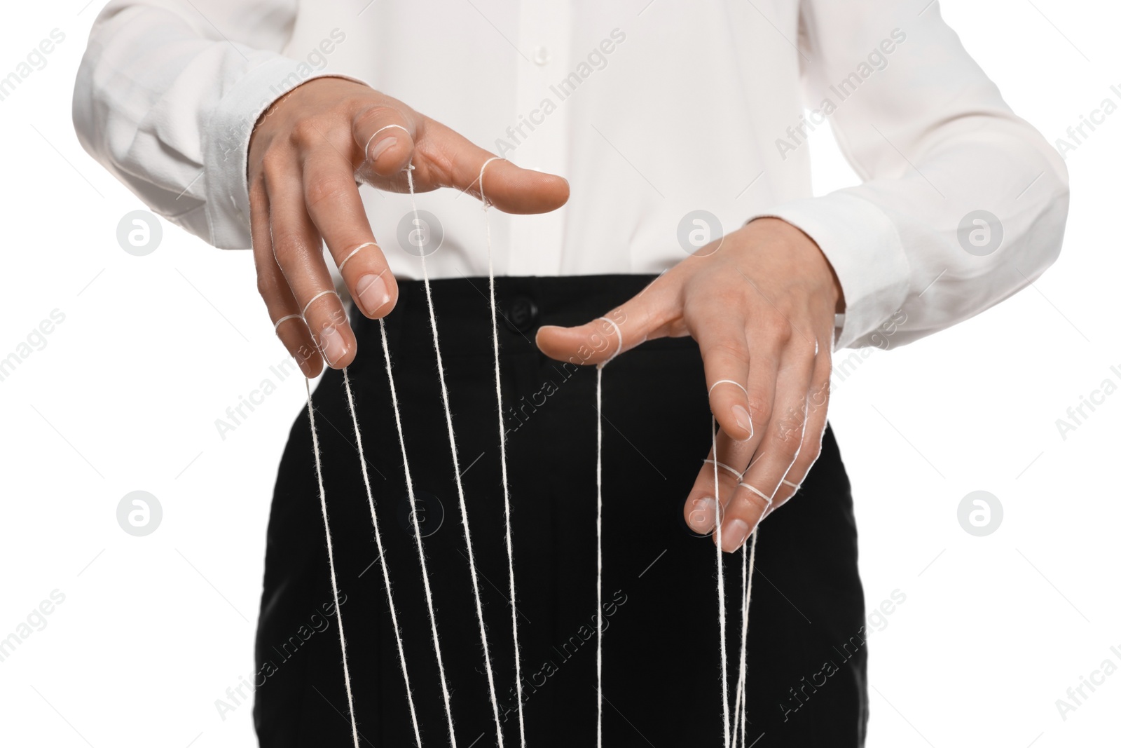 Photo of Woman in formal outfit pulling strings of puppet on white background, closeup