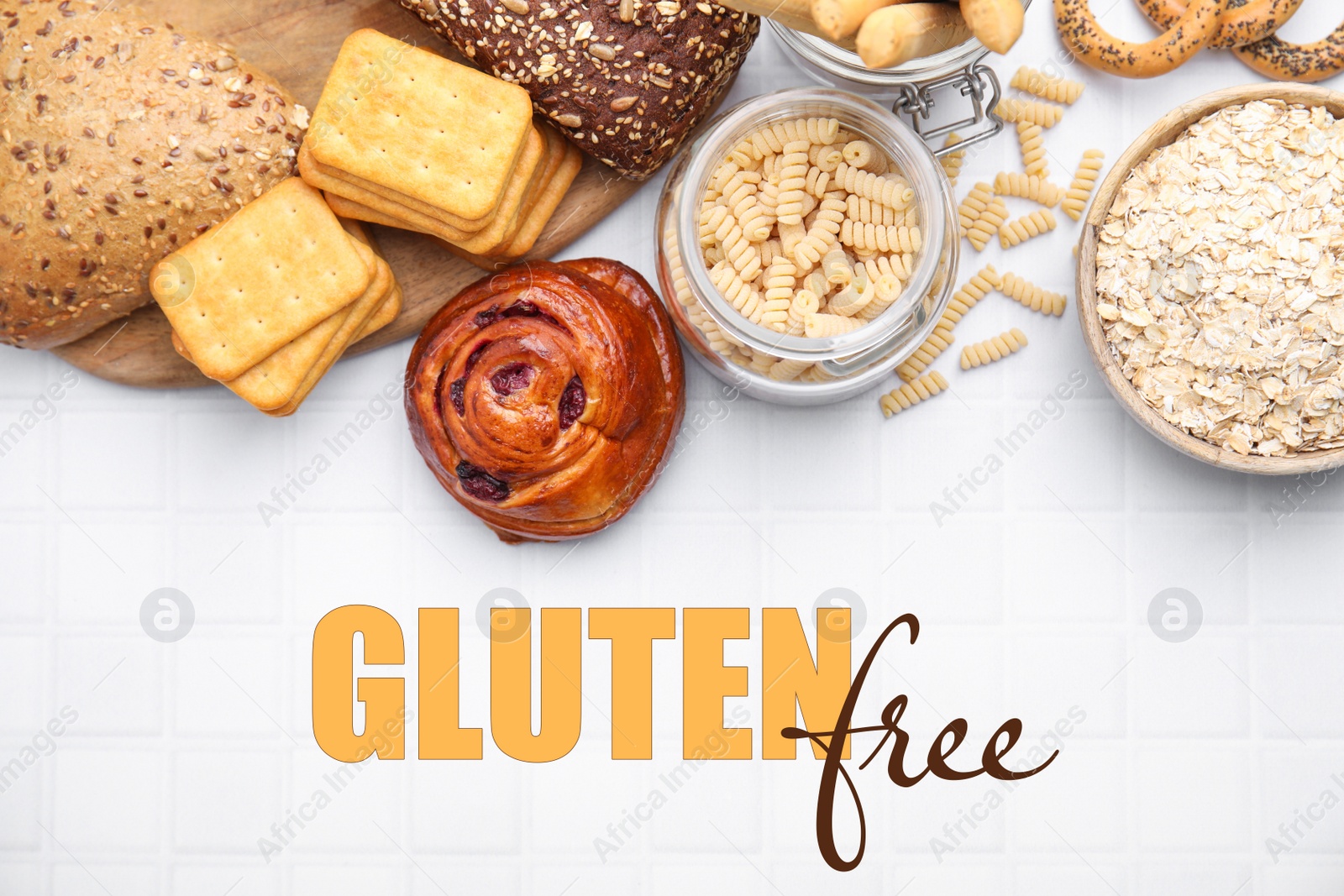 Image of Different gluten free products on white tiled table, flat lay