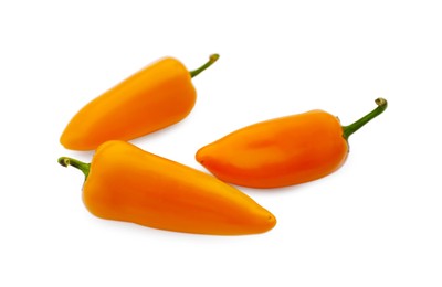 Photo of Fresh raw orange hot chili peppers isolated on white