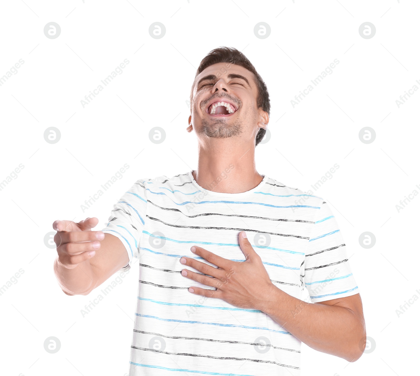 Photo of Portrait of handsome young man laughing on white background