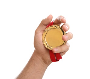 Man holding golden medal on white background, closeup. Space for design