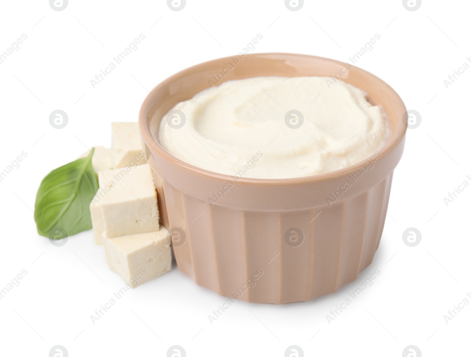 Photo of Delicious tofu, sauce and basil leaf isolated on white