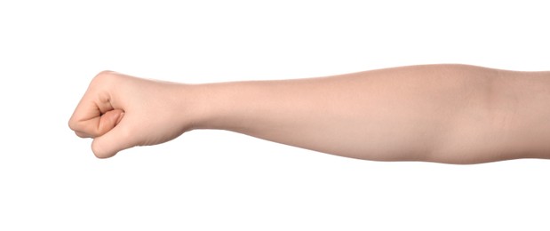 Photo of Playing rock, paper and scissors. Woman showing fist on white background, closeup