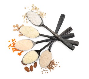 Photo of Spoons with different types of flours on white background