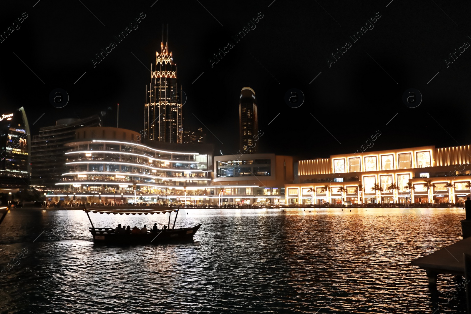 Photo of DUBAI, UNITED ARAB EMIRATES - NOVEMBER 04, 2018: Night cityscape with illuminated buildings