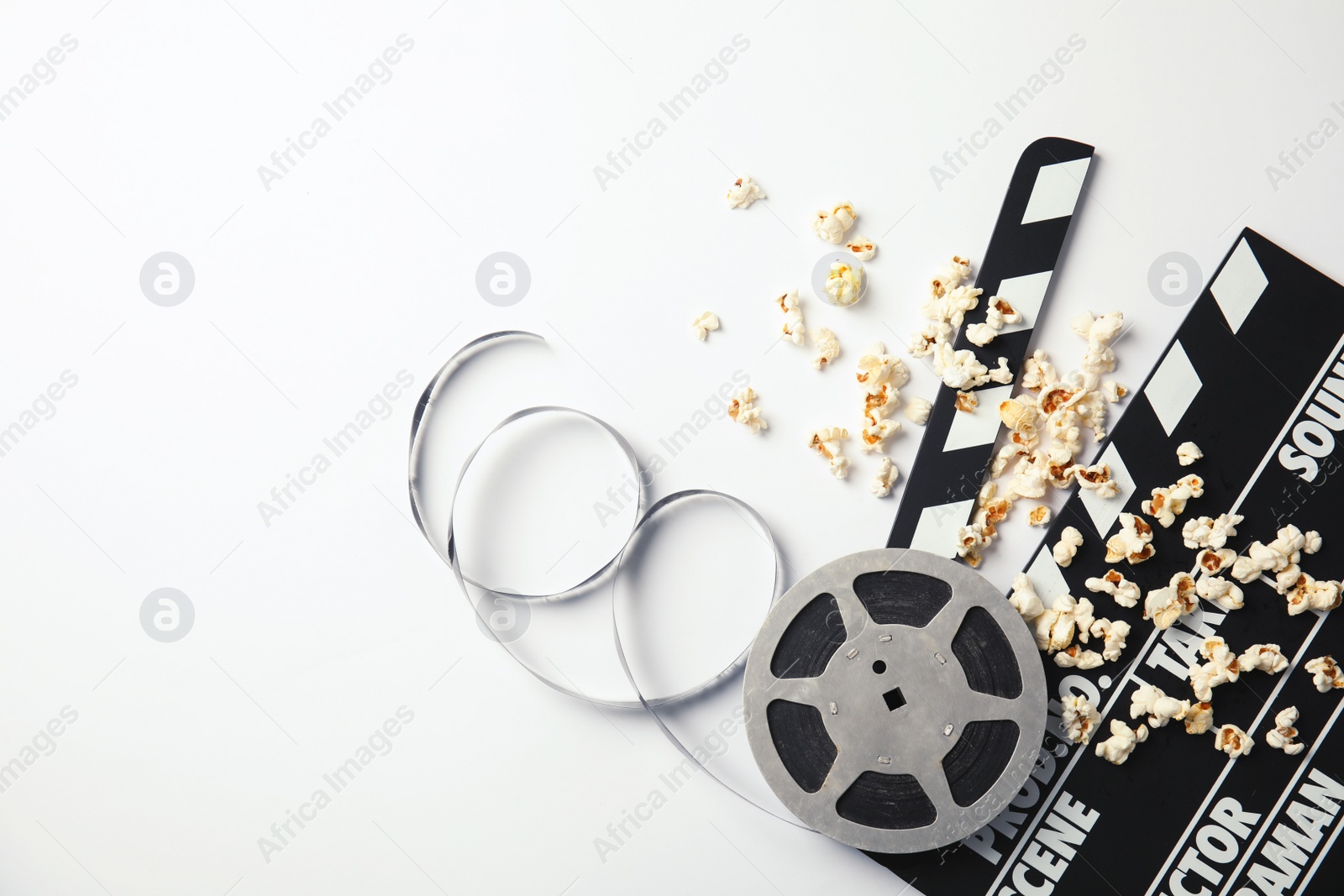 Photo of Flat lay composition with popcorn and space for text on white background. Cinema snack