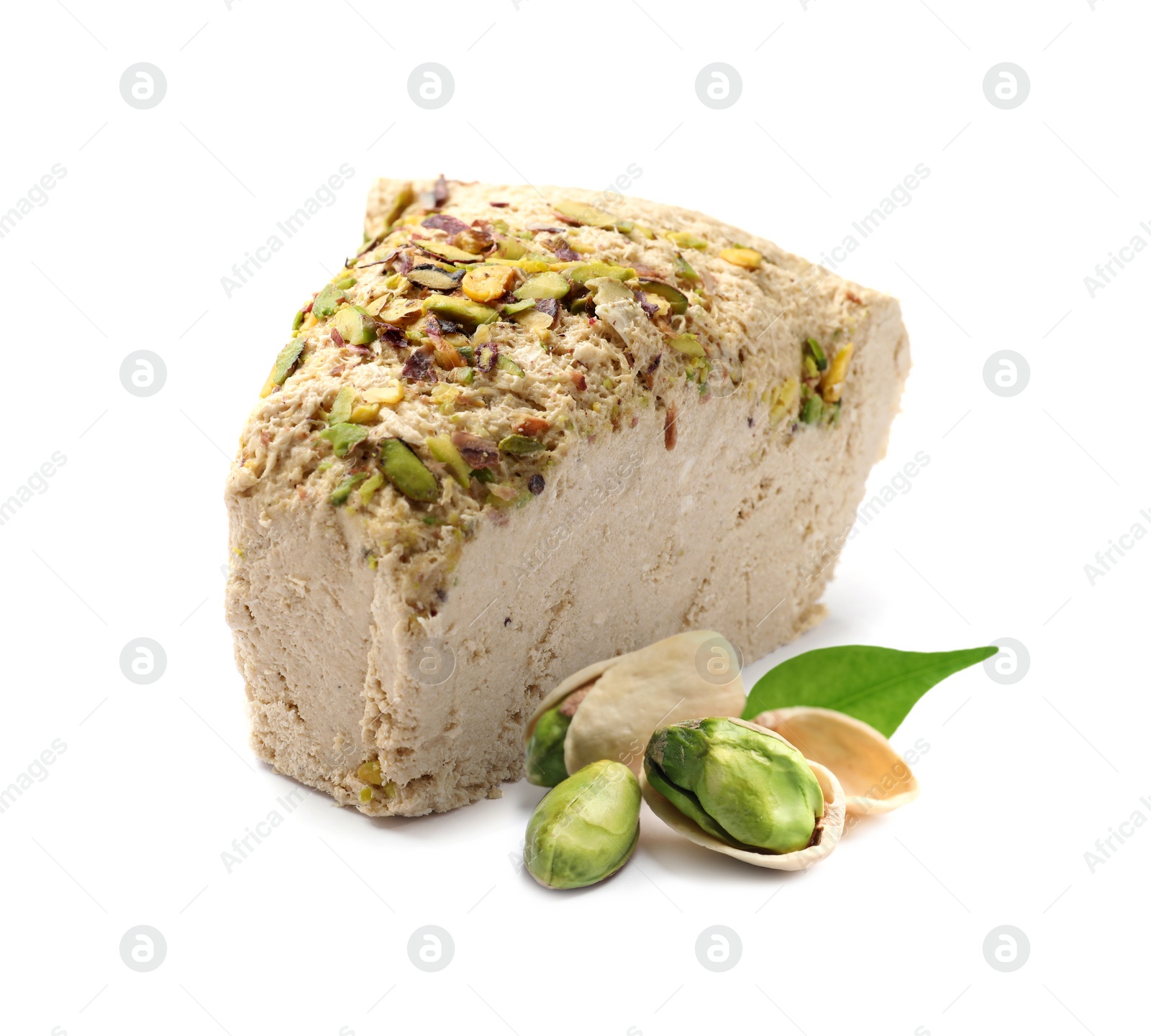 Image of Tasty halva, pistachio nuts and green leaf isolated on white