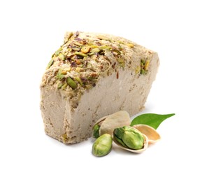 Image of Tasty halva, pistachio nuts and green leaf isolated on white