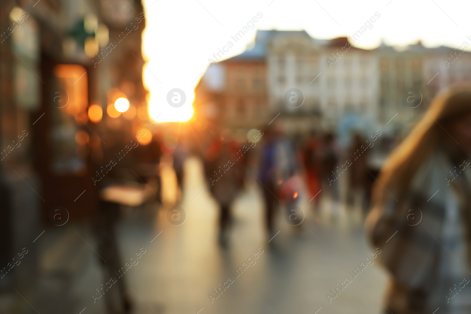 Photo of Blurred view of people walking on city street