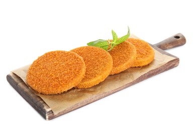 Delicious fried breaded cutlets with basil leaves isolated on white