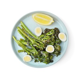 Tasty cooked broccolini with cheese, quail eggs and lemon isolated on white, top view