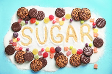 Photo of Composition with sugar and sweets on color background