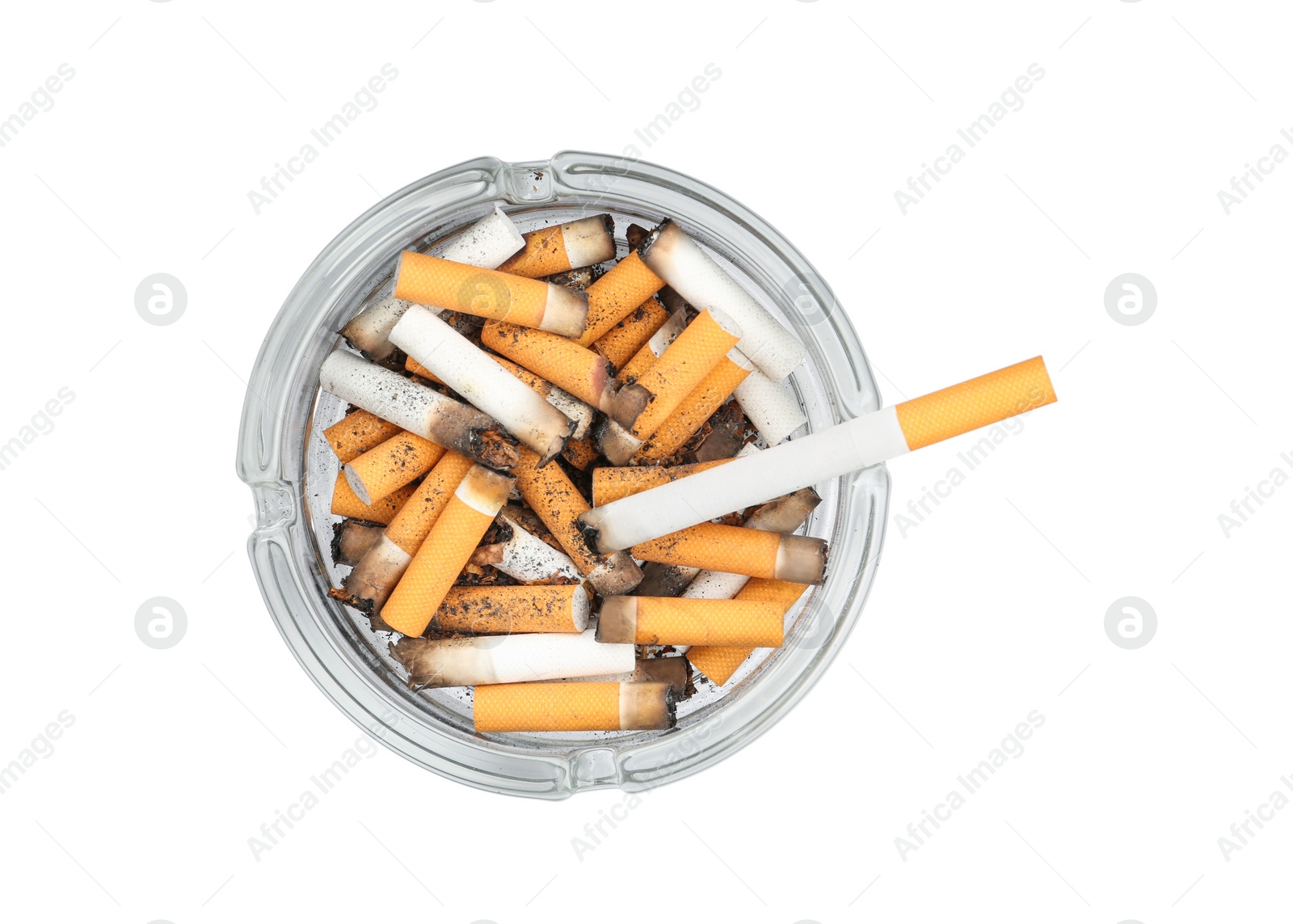 Photo of Glass ashtray full of cigarette stubs isolated on white, top view