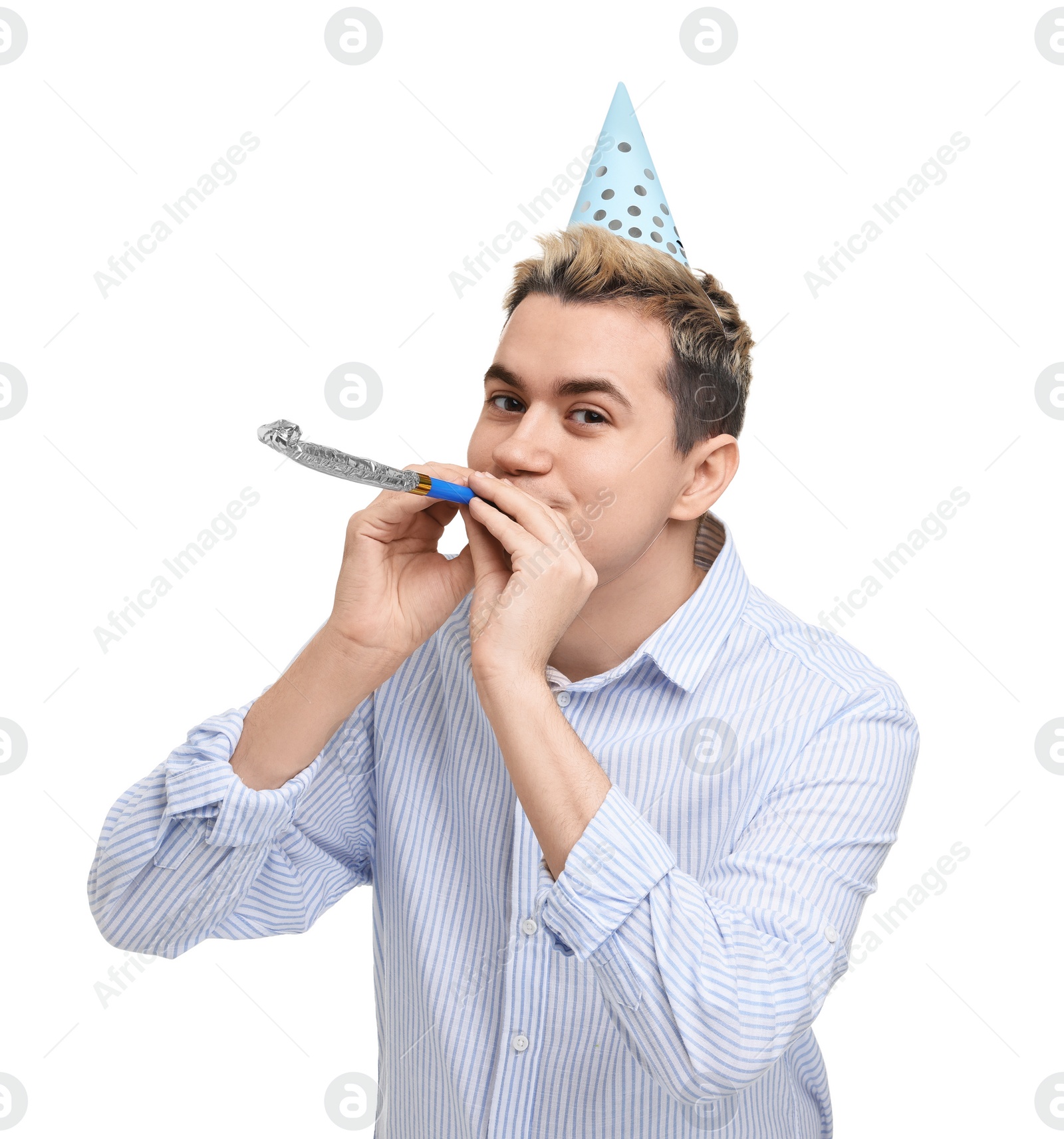 Photo of Young man with party hat and blower on white background