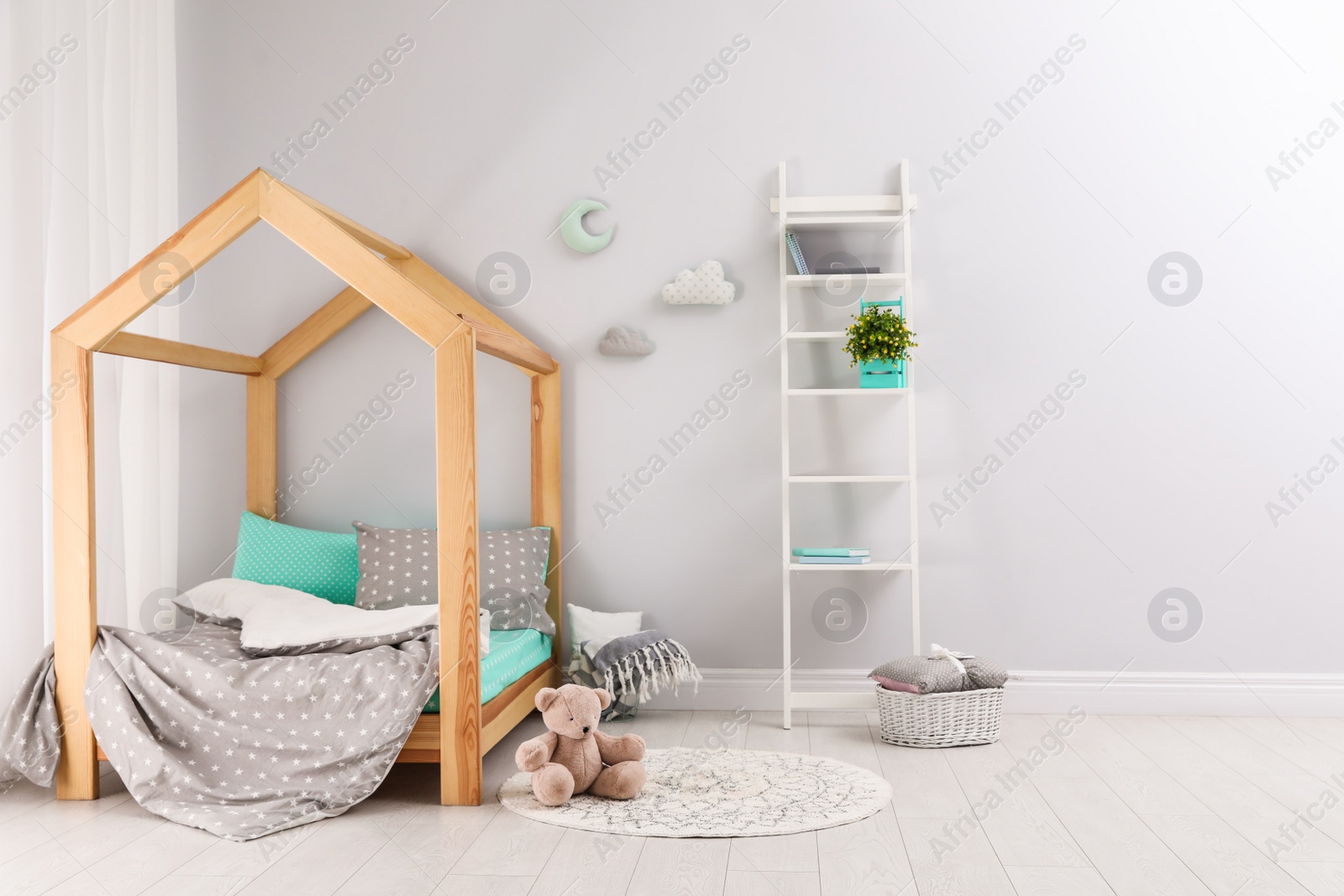 Photo of Stylish child room interior with comfortable bed