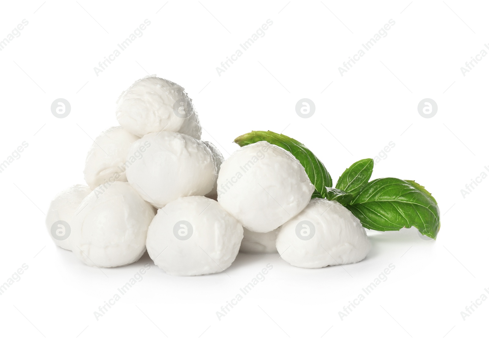 Photo of Delicious mozzarella cheese balls and basil on white background