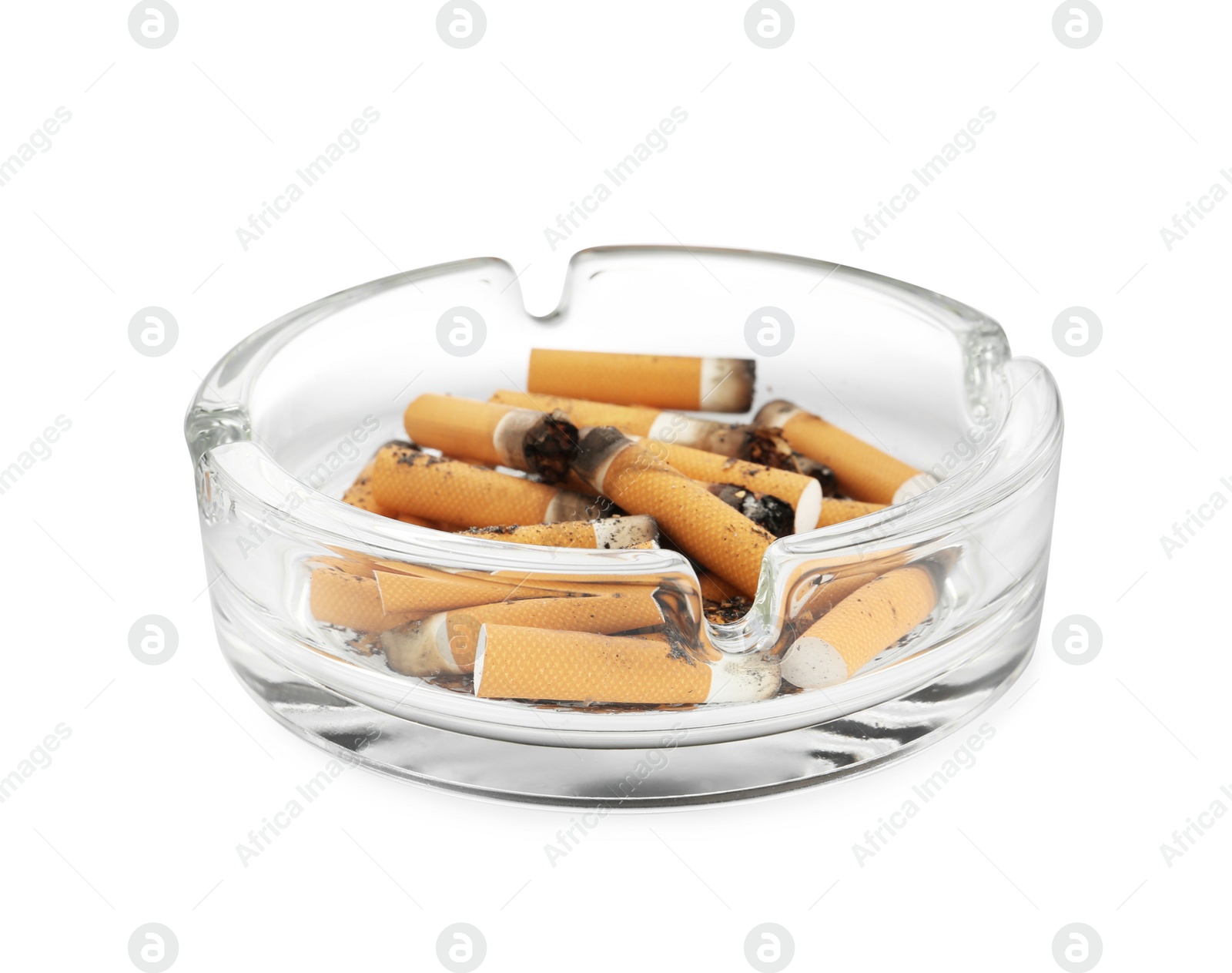 Photo of Glass ashtray with cigarette stubs isolated on white