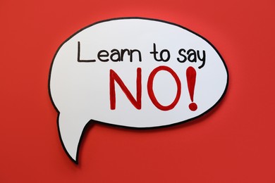 Photo of Paper speech bubble with phrase Learn to Say No on red background, top view