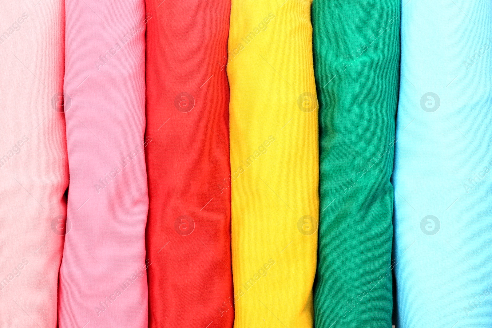 Photo of Many trendy colorful t-shirts, close up view