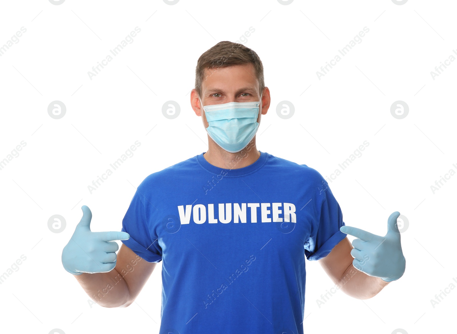 Photo of Male volunteer in mask and gloves on white background. Protective measures during coronavirus quarantine