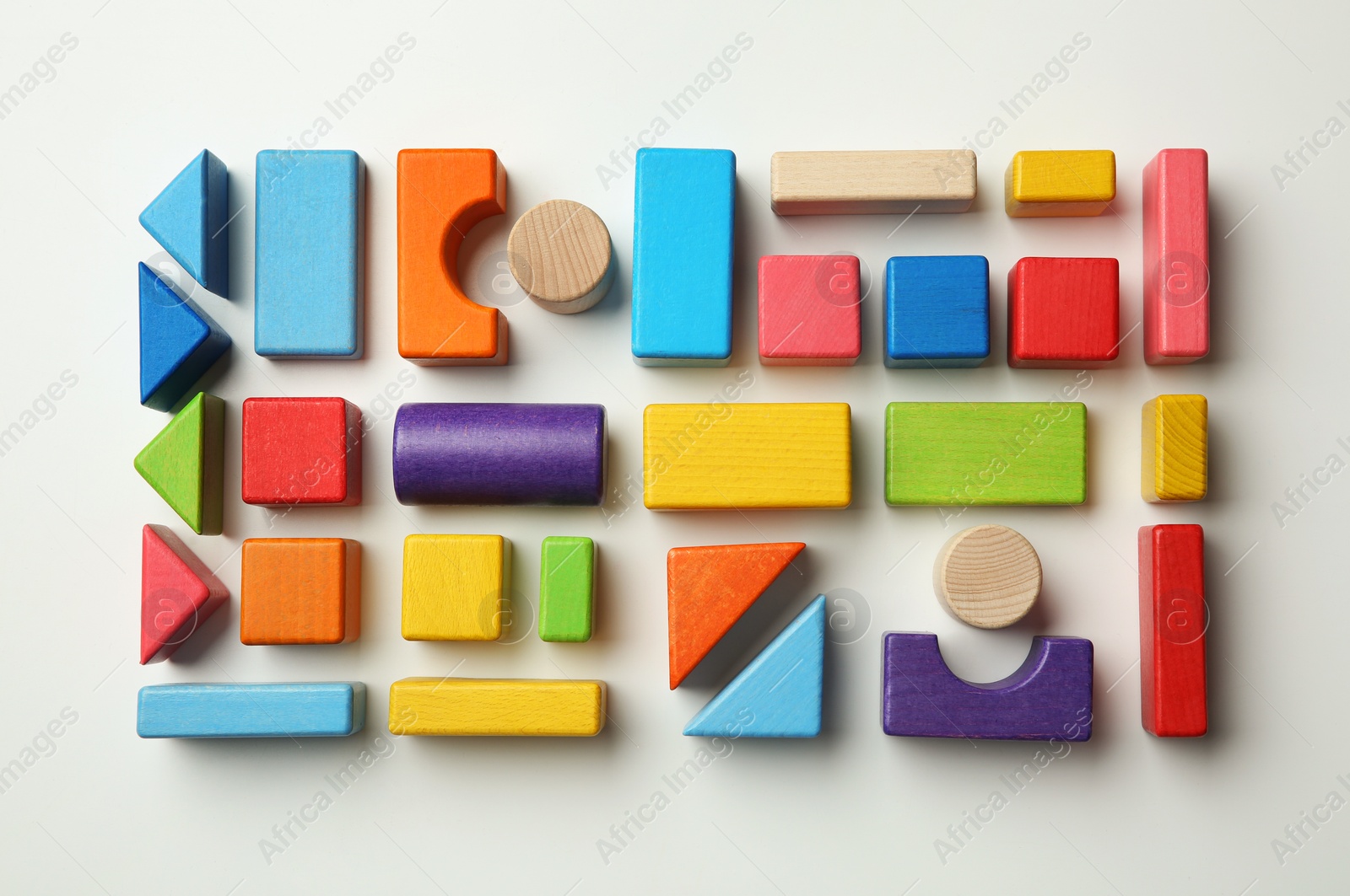 Photo of Colorful wooden construction set on white background top view