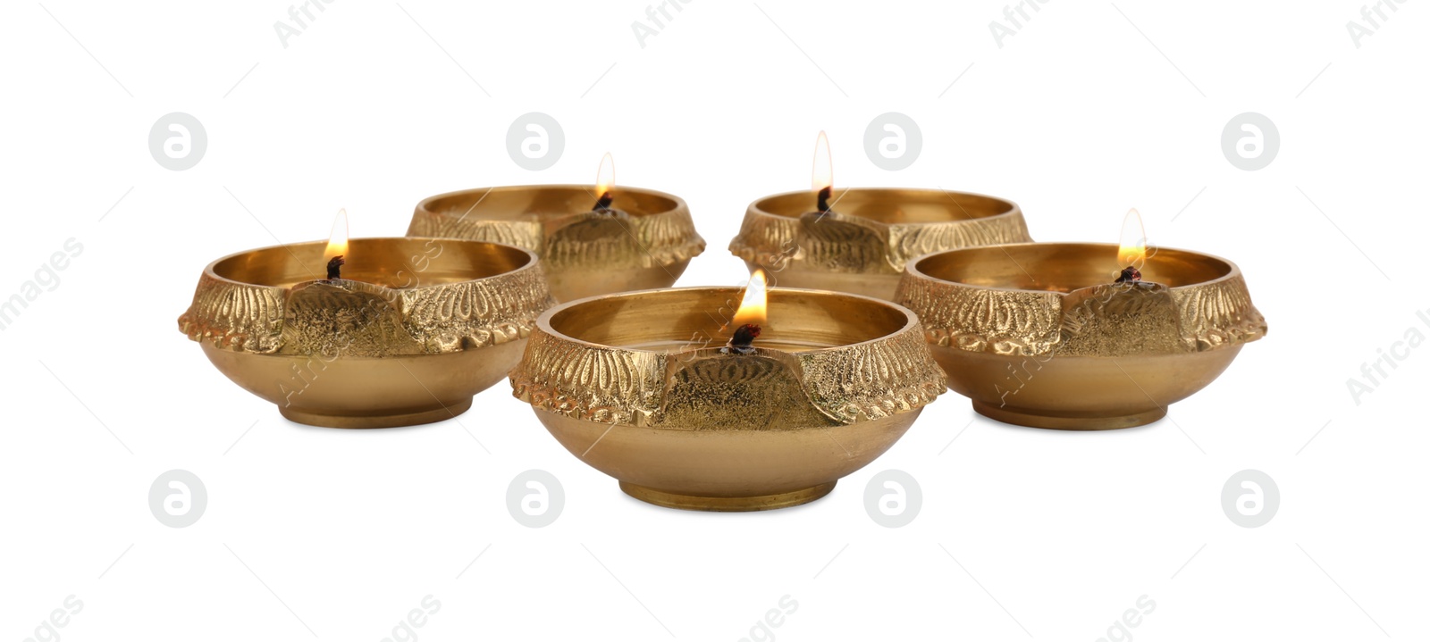 Photo of Lit diya lamps on white background. Diwali celebration
