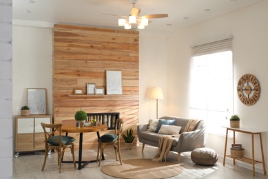 Photo of Stylish living room interior with modern ceiling fan