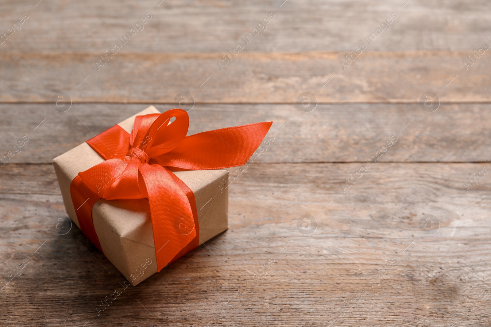 Photo of Beautiful gift box on wooden background