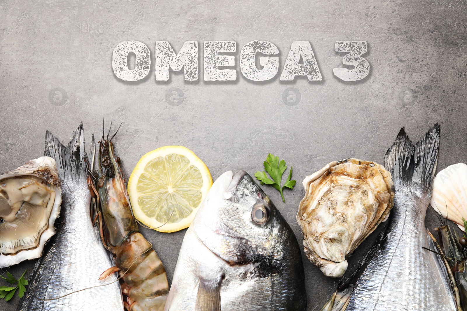 Image of Fresh seafood rich in Omega 3 oils on grey table, flat lay