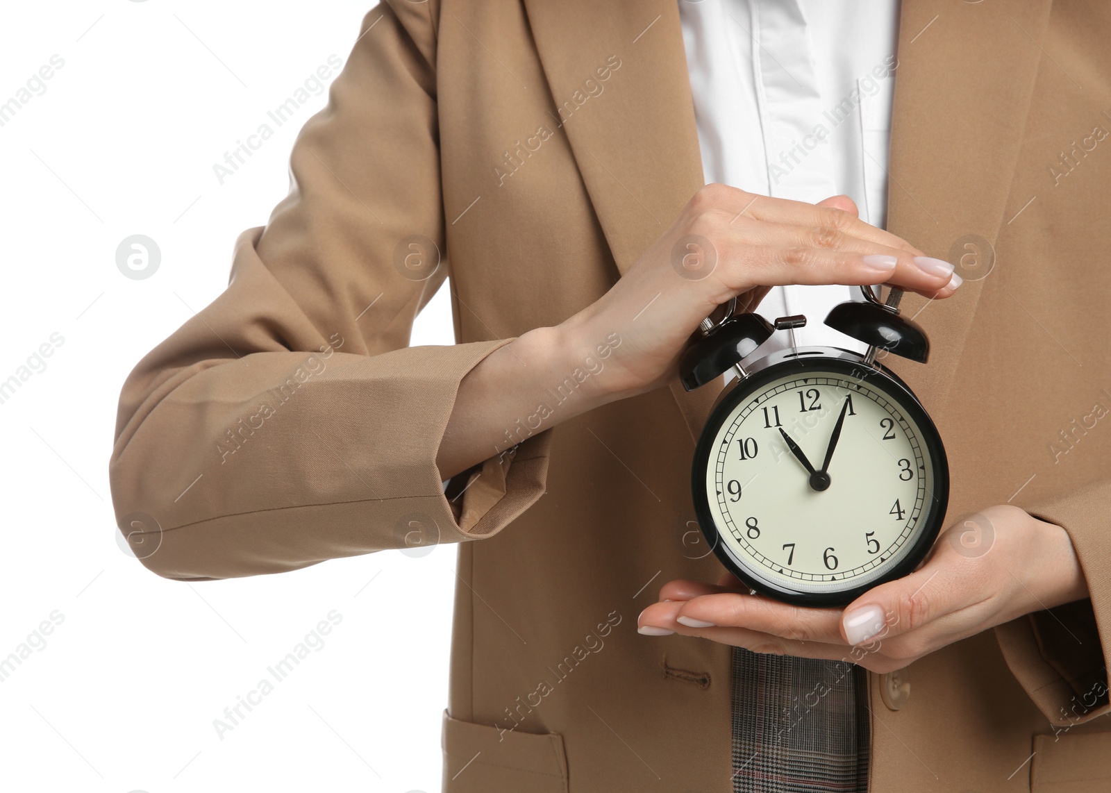 Photo of Businesswoman holding alarm clock on white background, closeup. Time management