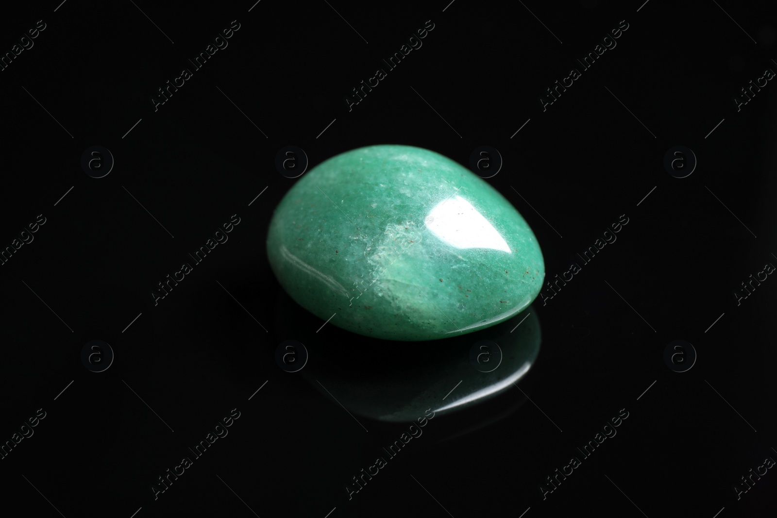 Photo of Beautiful green aventurine gemstone on black background