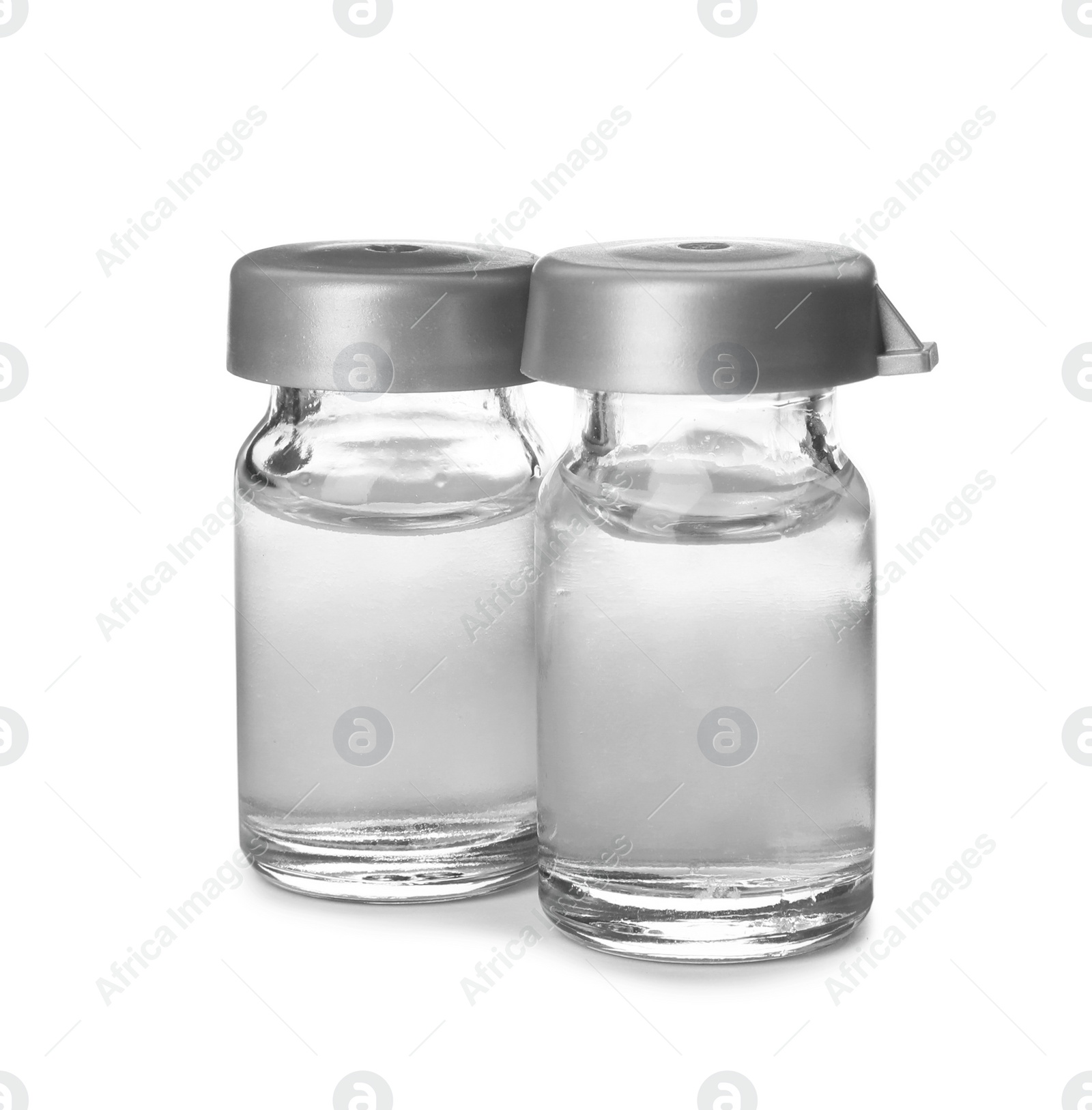 Photo of Medical vials with solution for injection on white background