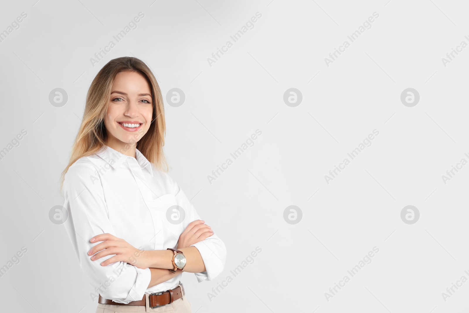 Photo of Portrait of beautiful young businesswoman on white background. Space for text