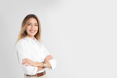 Portrait of beautiful young businesswoman on white background. Space for text