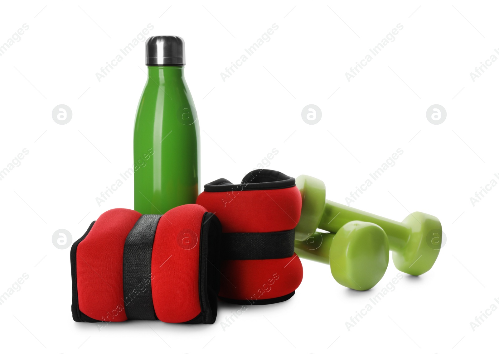 Photo of Stylish weighting agents, dumbbells and sport bottle on white background