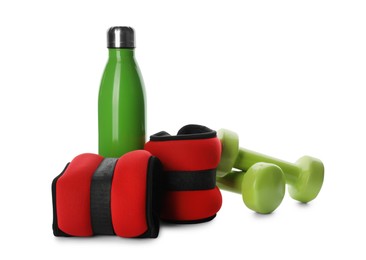 Photo of Stylish weighting agents, dumbbells and sport bottle on white background