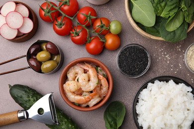 Photo of Ingredients for poke bowl on grey table, flat lay