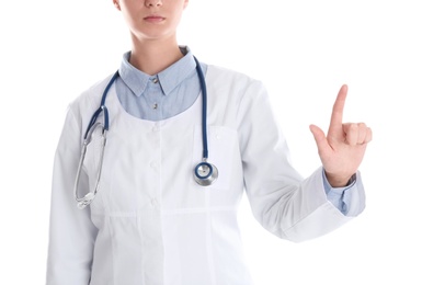 Female doctor pointing on white background, closeup