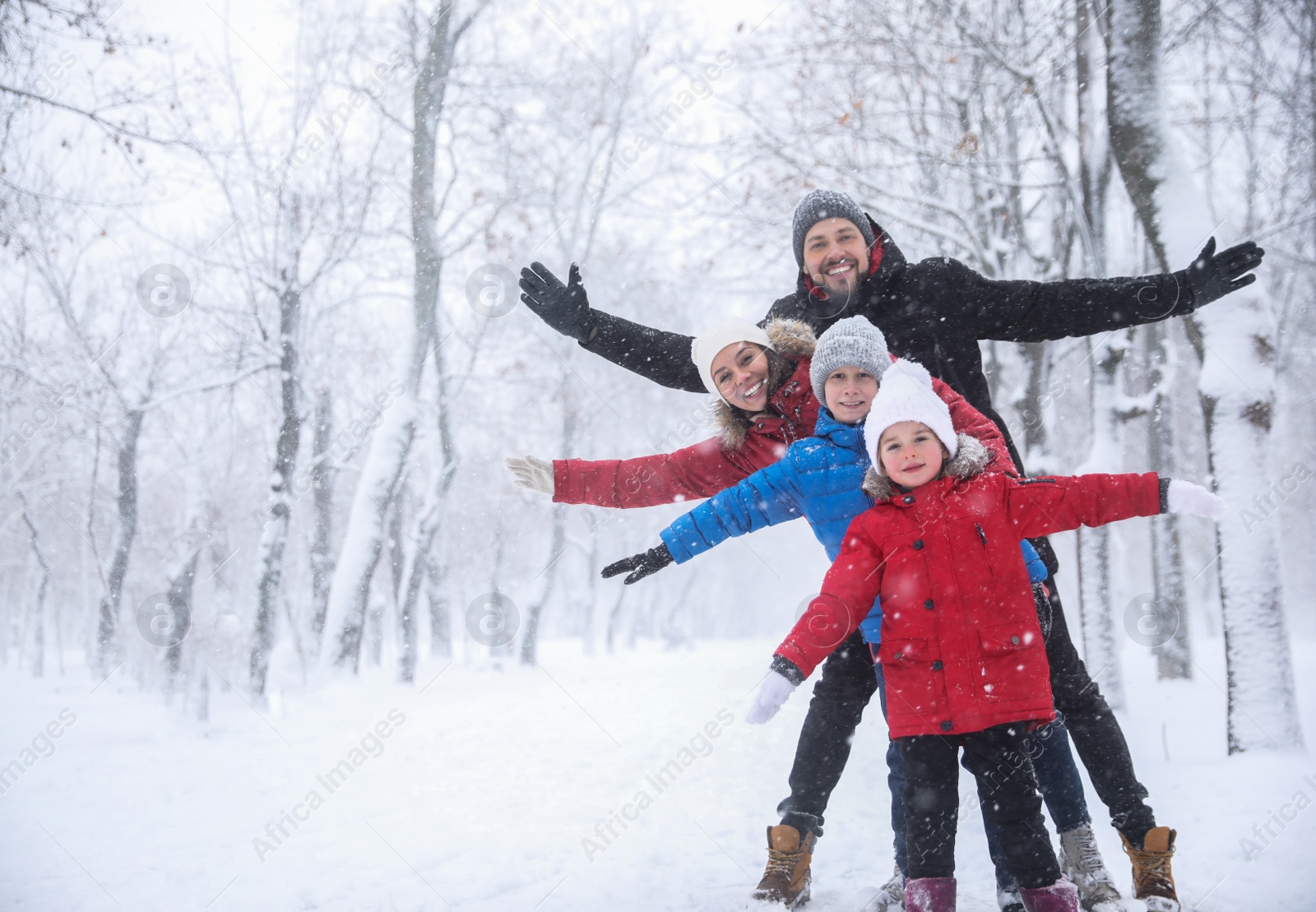 Photo of Family spending time outside on winter day, space for text. Christmas vacation