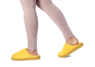 Photo of Woman in yellow soft slippers on white background, closeup