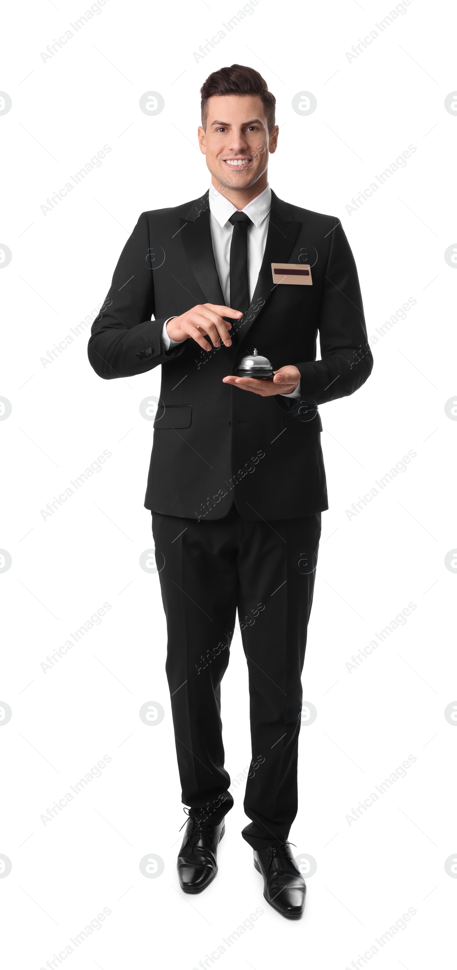 Photo of Happy receptionist in uniform holding service bell on white background