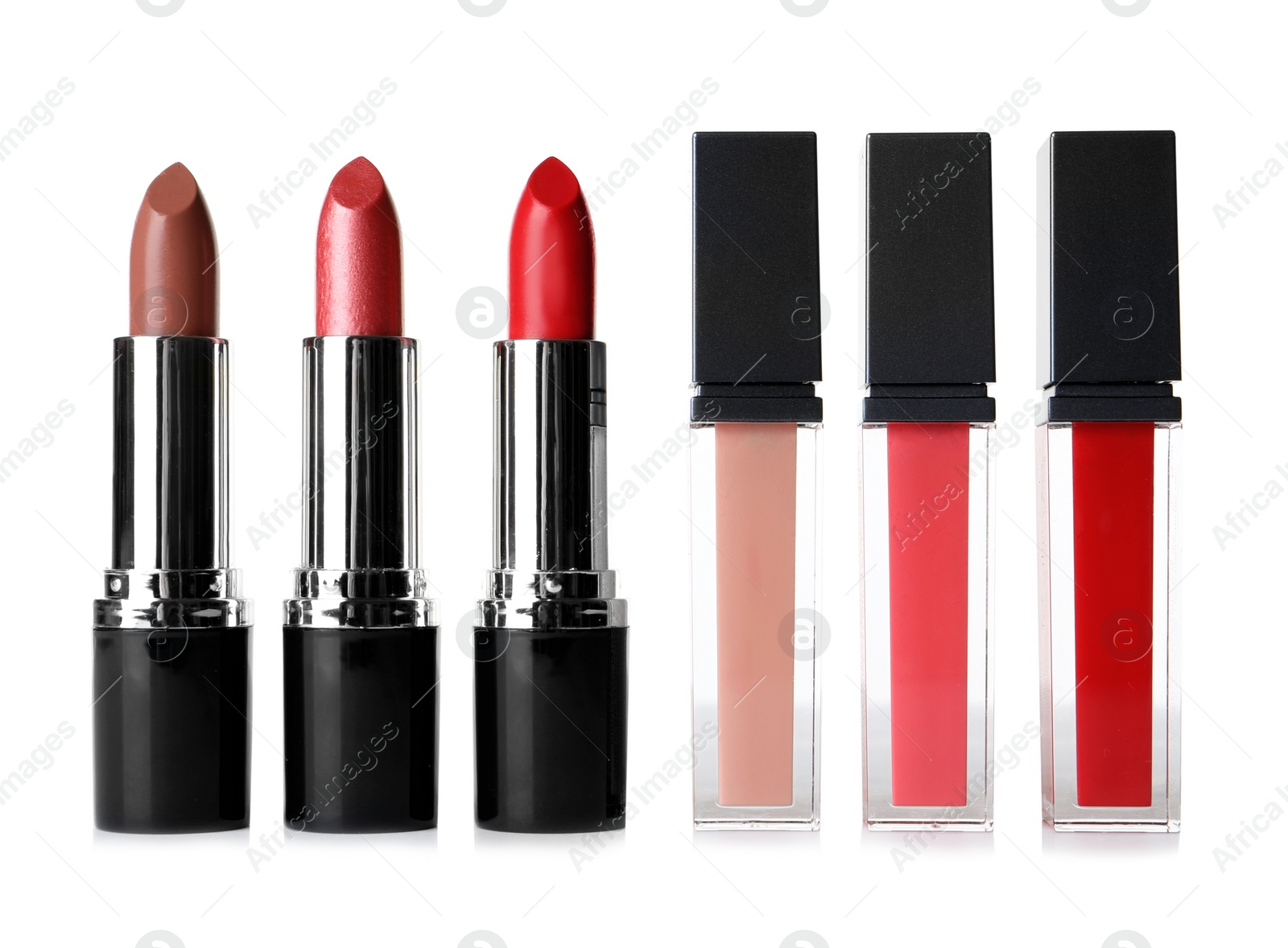 Photo of Different lipsticks on white background. Cosmetic product