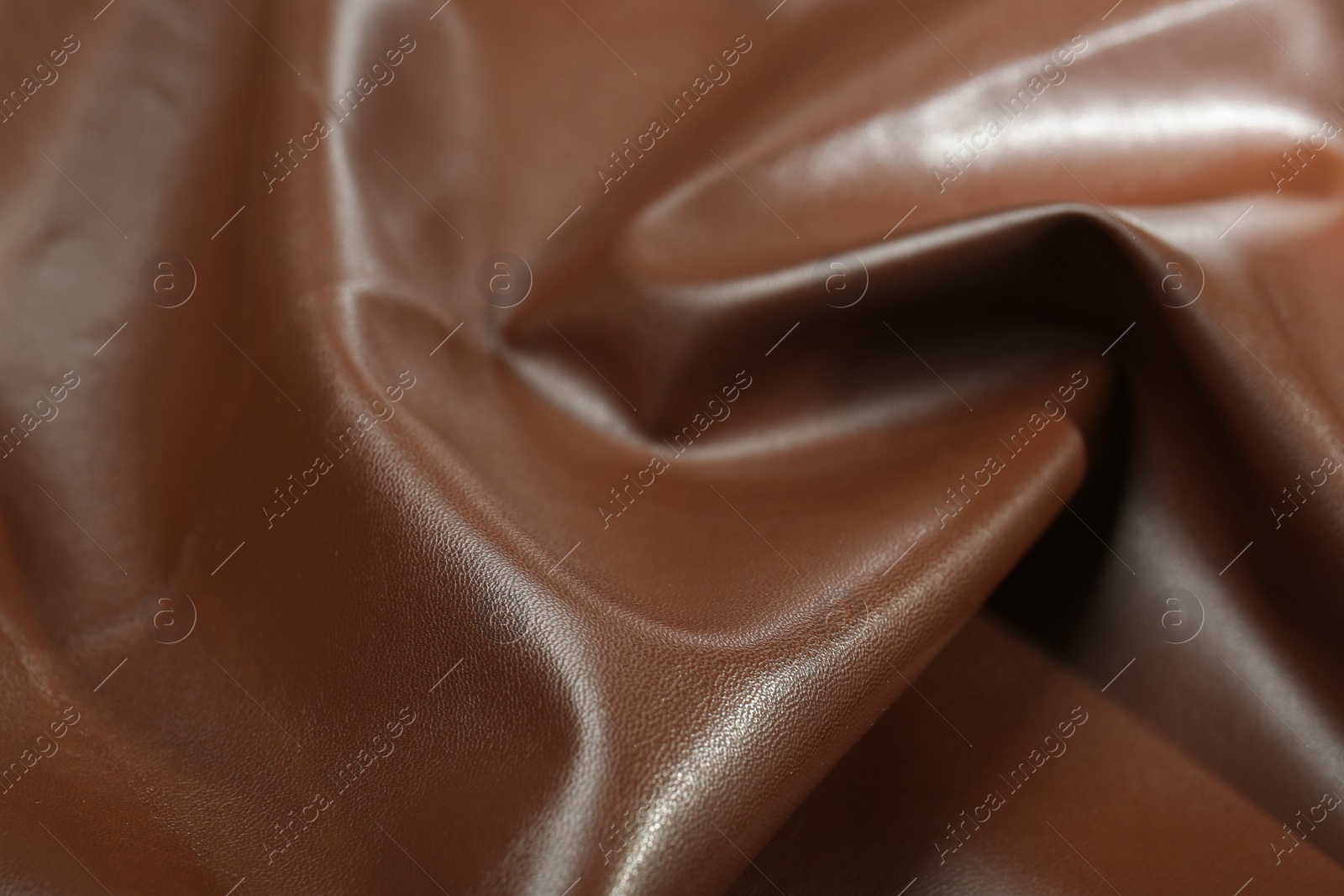 Photo of Brown natural leather as background, closeup view