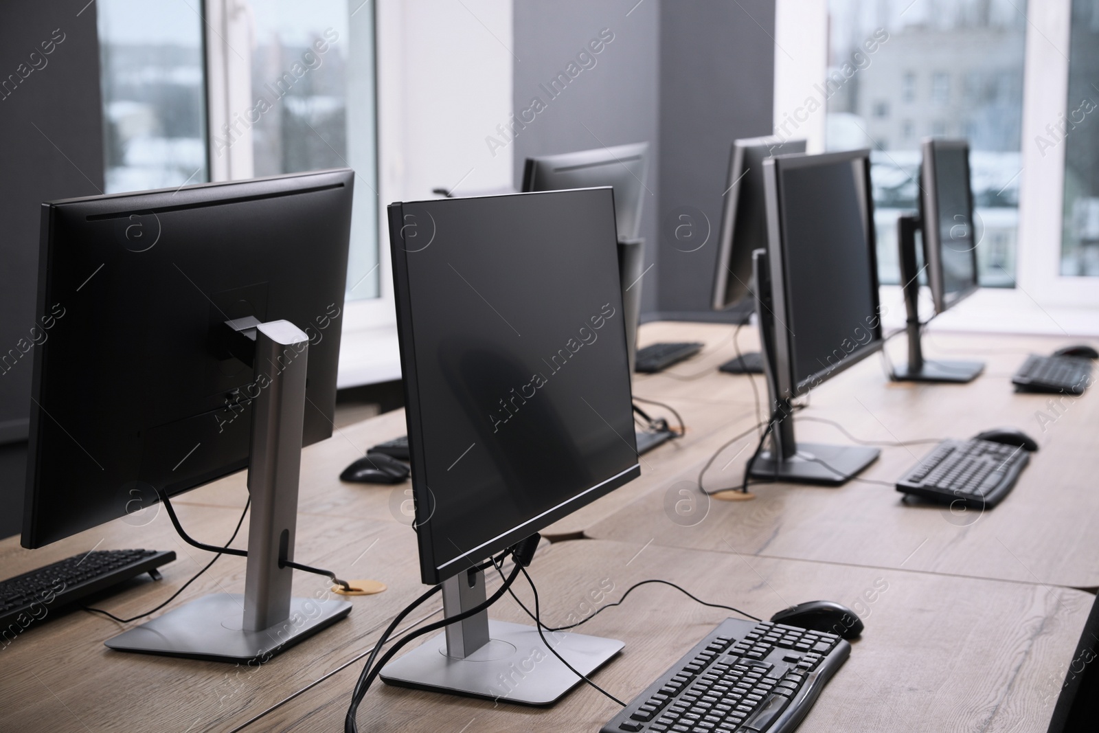 Photo of Many modern computers in open space office